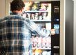 Man buying from vending machine.